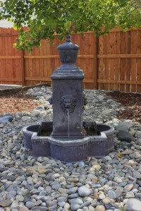 Creating an Outdoor Oasis With a Fountain - Wind River Realty